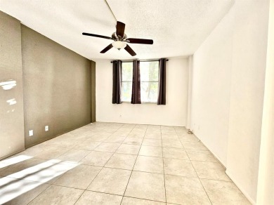 Beautiful 1BR/1.5BA condo with ceramic tile flooring in gated