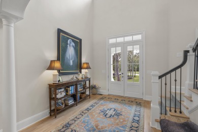 This Lowcountry Estate sits on a park-like private lot with