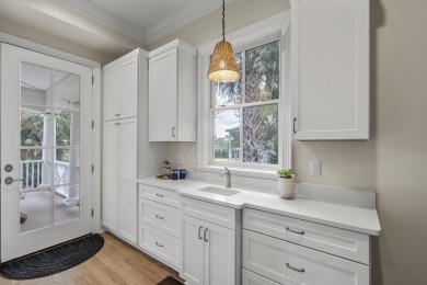 This Lowcountry Estate sits on a park-like private lot with