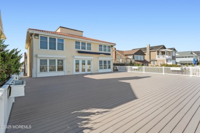 Beautiful Ocean Front Home sits gracefully on a pristine white