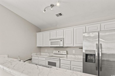 **Top-Floor End Unit in Elevator Building!**   This beautifully