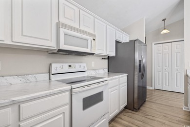 **Top-Floor End Unit in Elevator Building!**   This beautifully