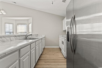 **Top-Floor End Unit in Elevator Building!**   This beautifully