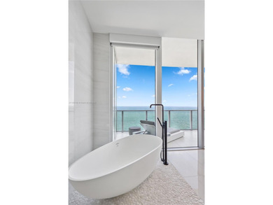 First time on the market, this 4 bed/5 bath penthouse spans 4