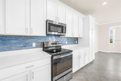 WATERFRONT LIVING IN A BOATING COMMUNITY.  Experience the