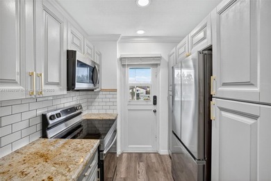 Top-floor unit w/ screened patio over peaceful water & pool