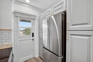 Top-floor unit w/ screened patio over peaceful water & pool