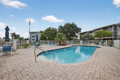 Top-floor unit w/ screened patio over peaceful water & pool