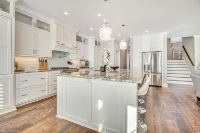 Experience luxury coastal living in this custom-designed 5