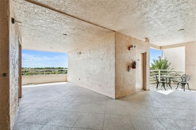 Enjoy luxury waterfront living in this premier fourth floor end