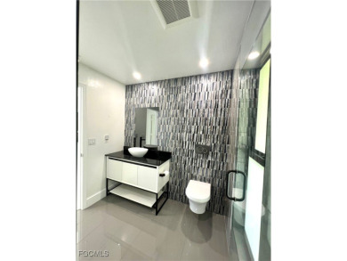 Modern Elegance Meets Florida Living in Imperial Golf Estates!