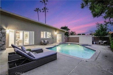 Enjoy coastal living in this inviting pool home with ocean views