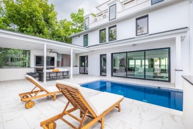 This remarkable contemporary residence on prestigious Murray