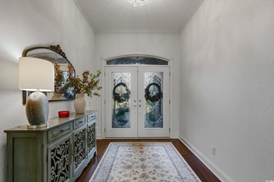 Come see this stunning *LAKE FRONT*custom built home located in