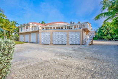 Nestled on a secluded 2-acre lot in Grassy Key, Marathon, this