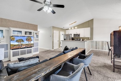 Spacious third-floor two-bedroom, two-bath condo located in an