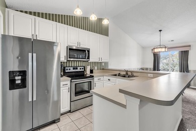 Spacious third-floor two-bedroom, two-bath condo located in an