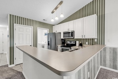 Spacious third-floor two-bedroom, two-bath condo located in an