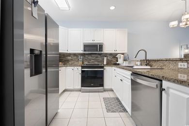 If you've been waiting for a fully renovated, first-floor condo