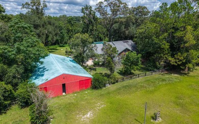 Welcome to this beautiful 5.17-acre gated property, perfectly