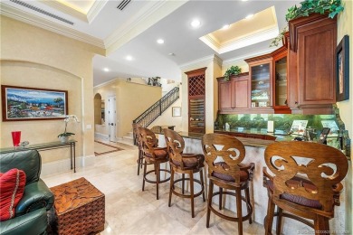 Water, water everywhere! This stunning Sailfish Point residence