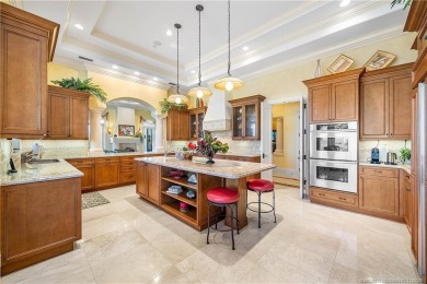 Water, water everywhere! This stunning Sailfish Point residence