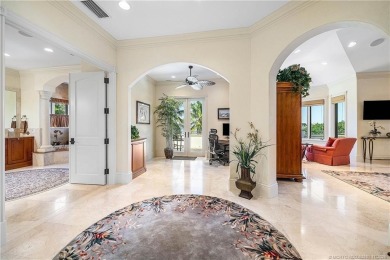 Water, water everywhere! This stunning Sailfish Point residence