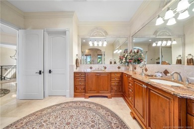 Water, water everywhere! This stunning Sailfish Point residence