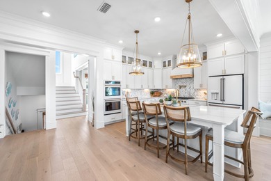 Nestled in the brand-new gated community of Bluewater Landing