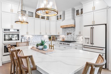 Nestled in the brand-new gated community of Bluewater Landing