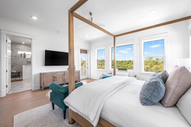 Nestled in the brand-new gated community of Bluewater Landing