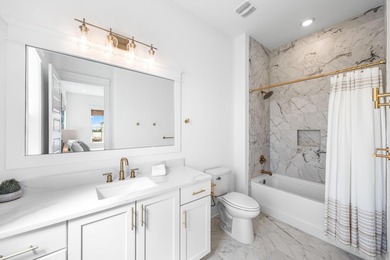 Nestled in the brand-new gated community of Bluewater Landing