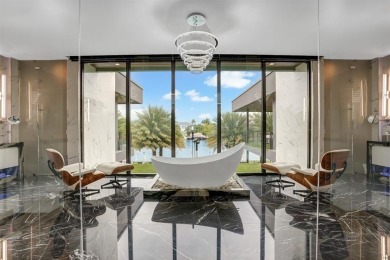 An unparalleled gated waterfront estate located on the deep