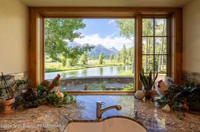 Set on the Snake River with 42.57 acres & dramatic Teton views