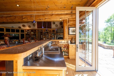 Set on the Snake River with 42.57 acres & dramatic Teton views