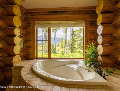 Set on the Snake River with 42.57 acres & dramatic Teton views