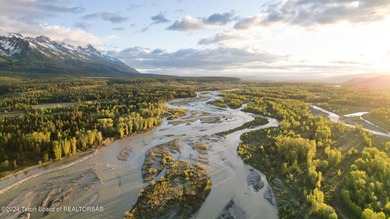 Set on the Snake River with 42.57 acres & dramatic Teton views