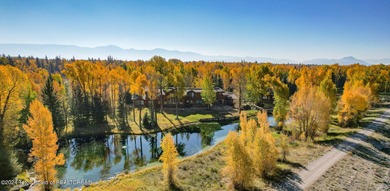 Set on the Snake River with 42.57 acres & dramatic Teton views
