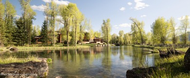 Set on the Snake River with 42.57 acres & dramatic Teton views