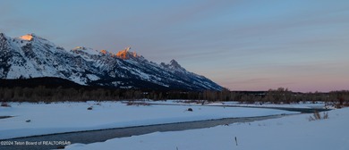 Set on the Snake River with 42.57 acres & dramatic Teton views
