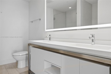 Soaring high on the 25th floor, this sought-after Line 04 unit