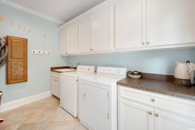 Nestled on a serene 1.88 acre wooded lot, enjoy resort-style