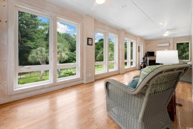 Nestled on a serene 1.88 acre wooded lot, enjoy resort-style