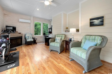 Nestled on a serene 1.88 acre wooded lot, enjoy resort-style