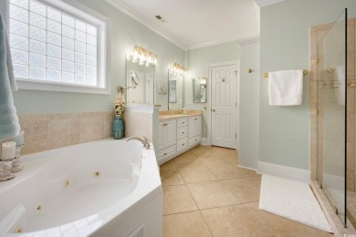 Nestled on a serene 1.88 acre wooded lot, enjoy resort-style