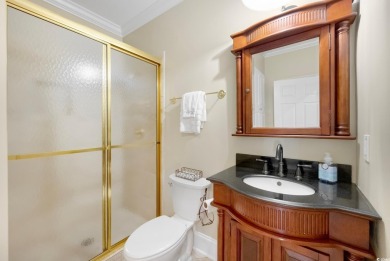 Nestled on a serene 1.88 acre wooded lot, enjoy resort-style