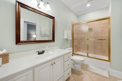 Nestled on a serene 1.88 acre wooded lot, enjoy resort-style