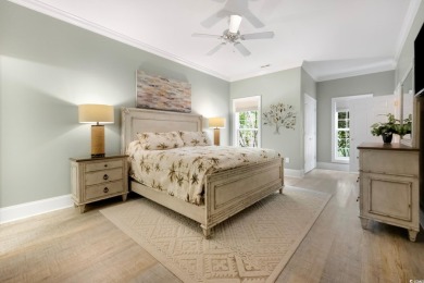 Nestled on a serene 1.88 acre wooded lot, enjoy resort-style