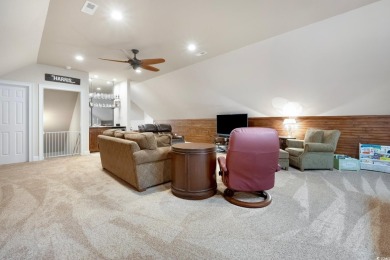 Nestled on a serene 1.88 acre wooded lot, enjoy resort-style