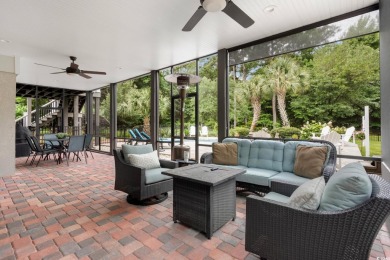 Nestled on a serene 1.88 acre wooded lot, enjoy resort-style